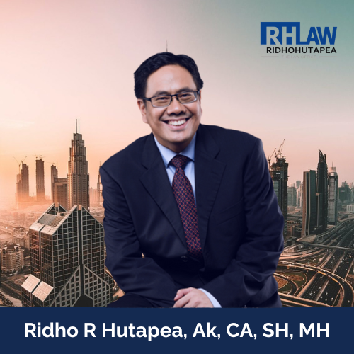 Portrait photo of Ridho R. Hutapea in business suit